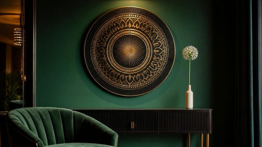Bold minimalist statement wall with a black and gold circular calligraphic medallion canvas on emerald green, representing Surah Al-Ikhlas